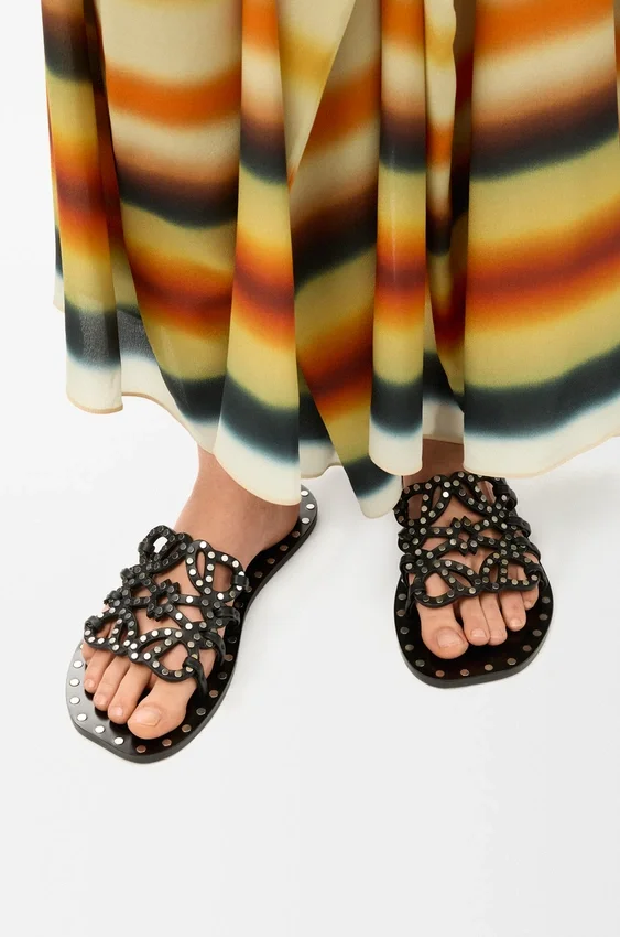 Petal Anagram Slide in Vegetable-Tanned Calfskin and Metallic Studs Petal Anagram Slide in Vegetable-Tanned Calfskin and Metallic Studs